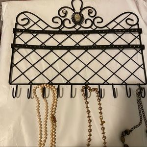 Beautiful black matte wall hanging jewelry organizer.